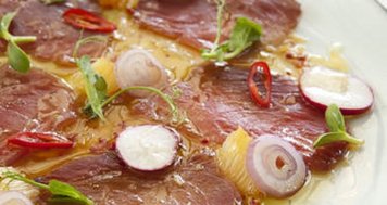 Ahi Tuna Carpaccio with Red Onion, Parsley, and Pink Peppercorns