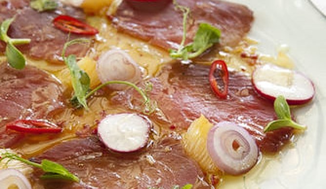 Ahi Tuna Carpaccio with Red Onion, Parsley, and Pink Peppercorns