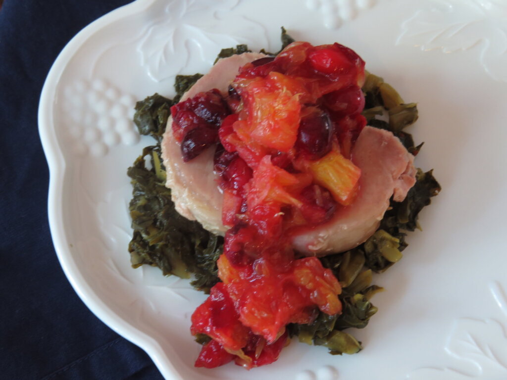 Pork Chop with Cranberry Orange Sauce over Collards