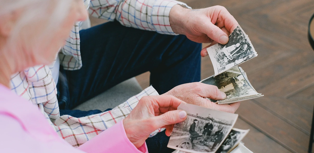 old couple looking at their photos